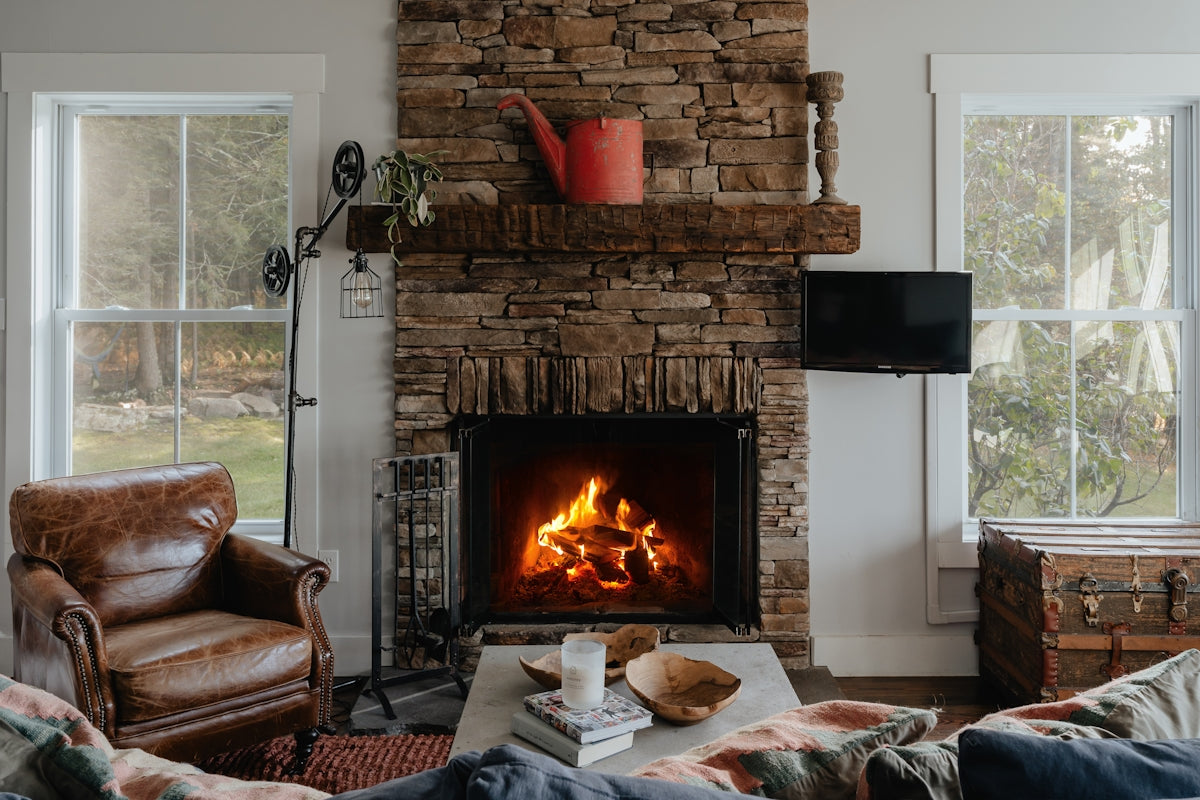 a living room filled with furniture and a fire place