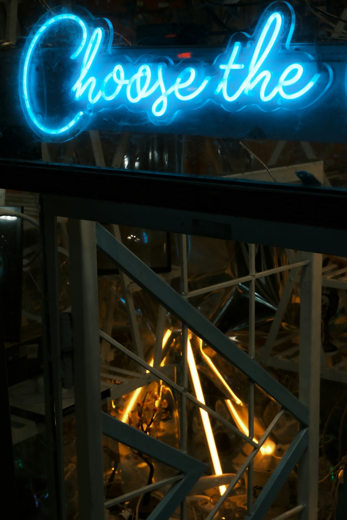 Blue neon sign says choose the